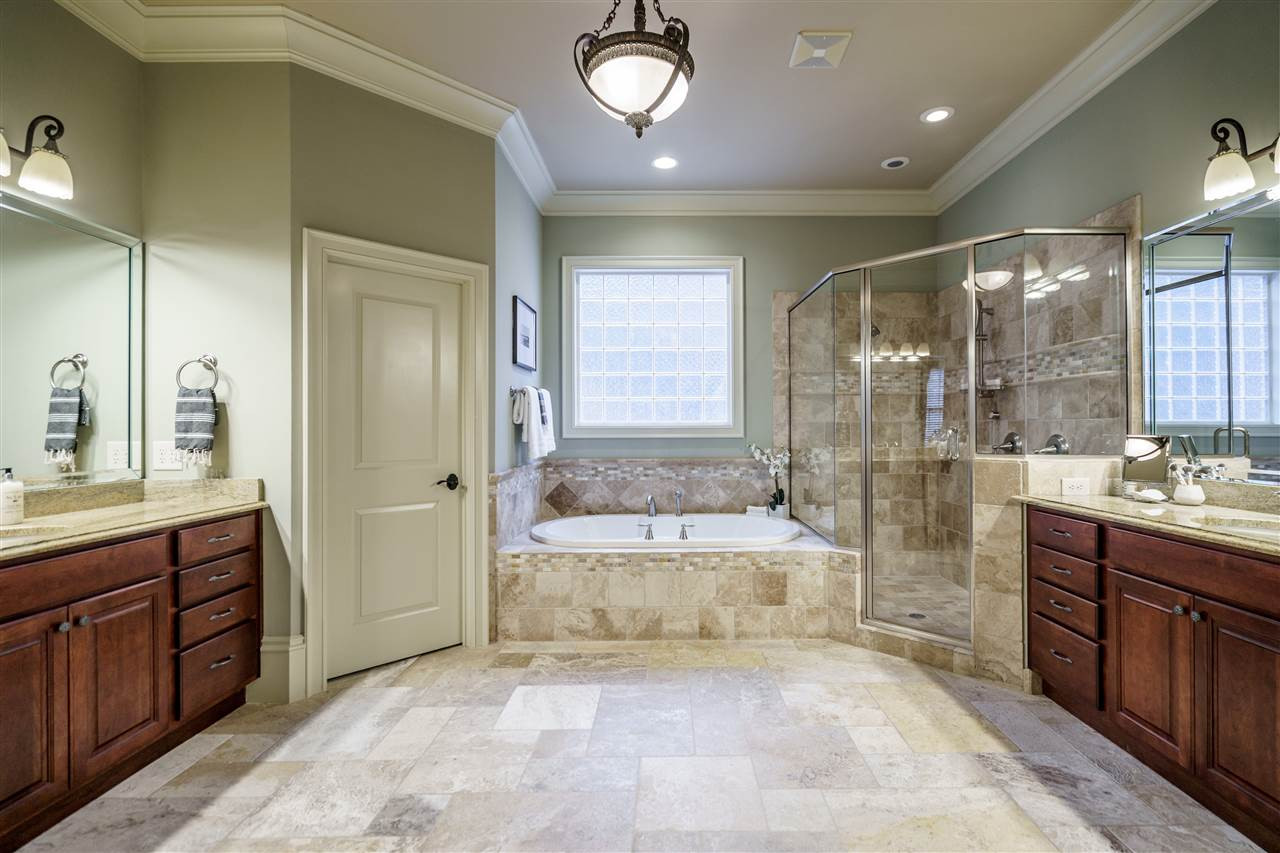 2411 Trenton Woods Way Raleigh, NC 27607 - Photo 17 of 29 Spa-like bathroom, with separate, double vanities and oversized tub. Master Bath