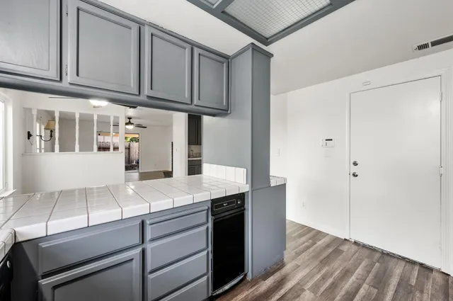 a kitchen with stainless steel appliances granite countertop a sink and cabinets