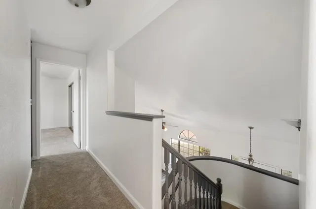 a view of a hallway with staircase