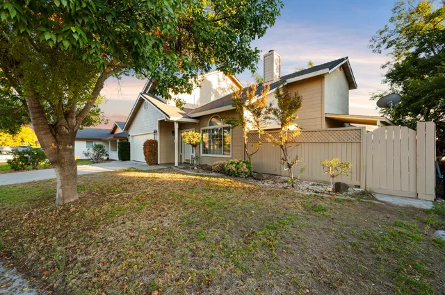 a house with trees in the background