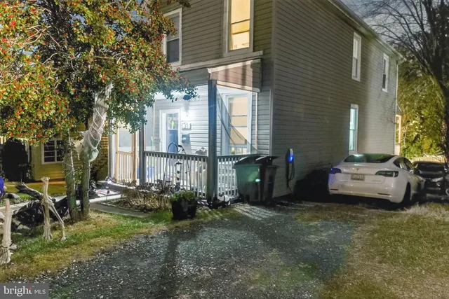 a view of backyard with barbeque grill and outdoor seating