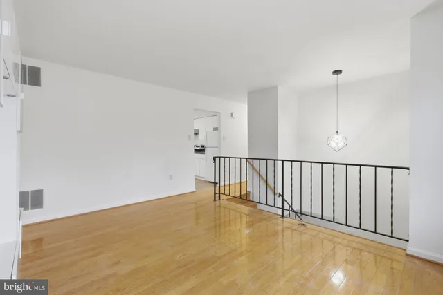 a kitchen with a sink cabinets stainless steel appliances and a window