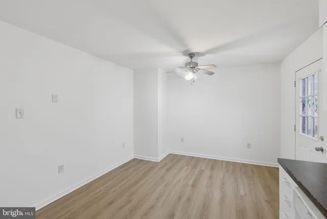 a kitchen with granite countertop a sink and a stove top oven