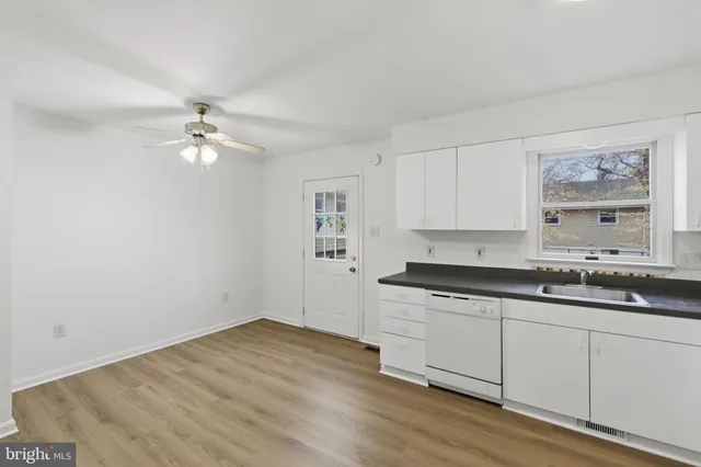 a bathroom with a sink a toilet and vanity