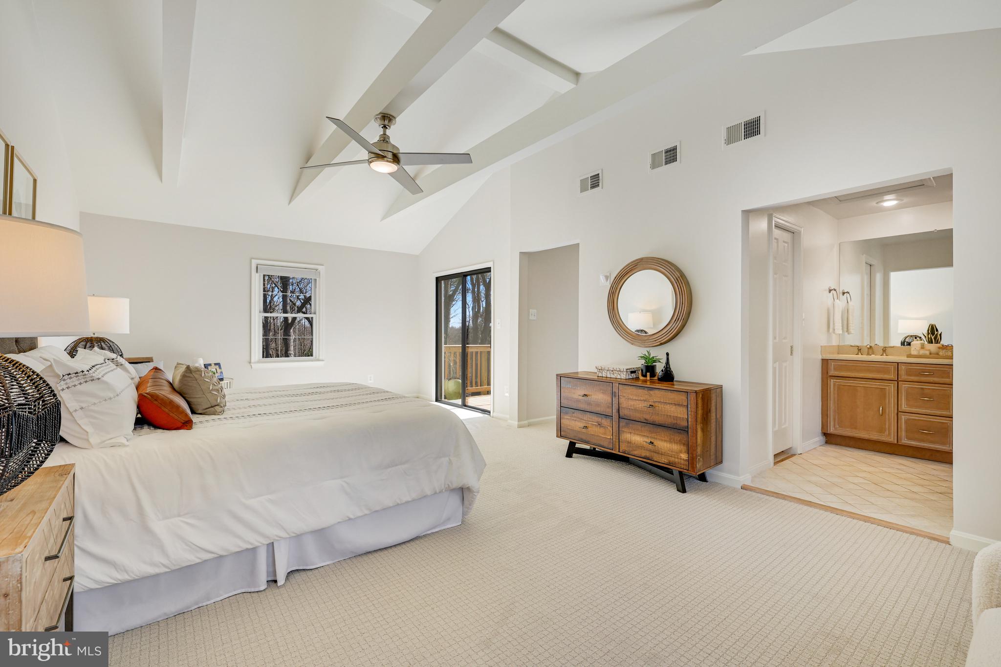 1807 Post Oak Trail Reston, VA 20191 - Photo 32 of 79 a bedroom with a bed and a chandelier