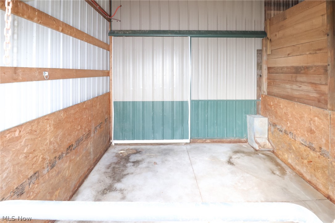 1153 East Pleasant Home Road Wooster, OH 44691 - Photo 40 of 48 Inside the lean-to area previously used as a stall or other livestock pen.