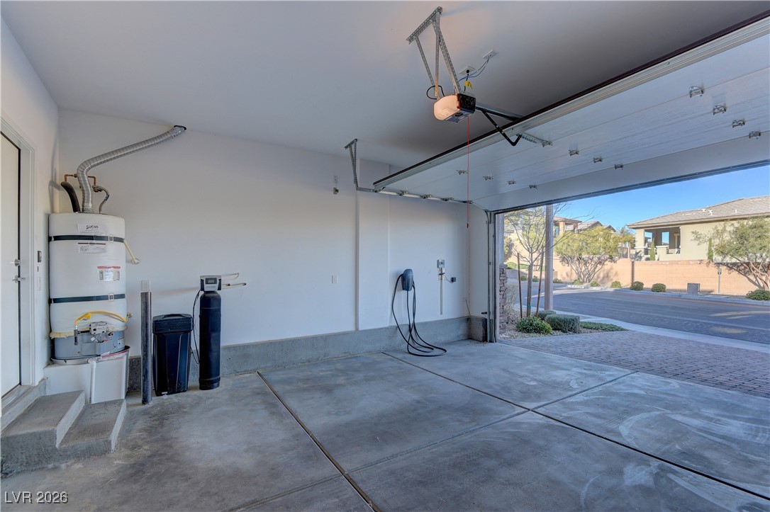 727 Foreign Reef Way Las Vegas, NV 89138 - Photo 11 of 25 Garage with strapped water heater and a garage door opener