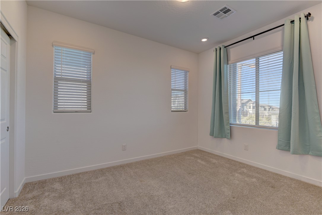 727 Foreign Reef Way Las Vegas, NV 89138 - Photo 21 of 25 Unfurnished bedroom featuring a closet and carpet