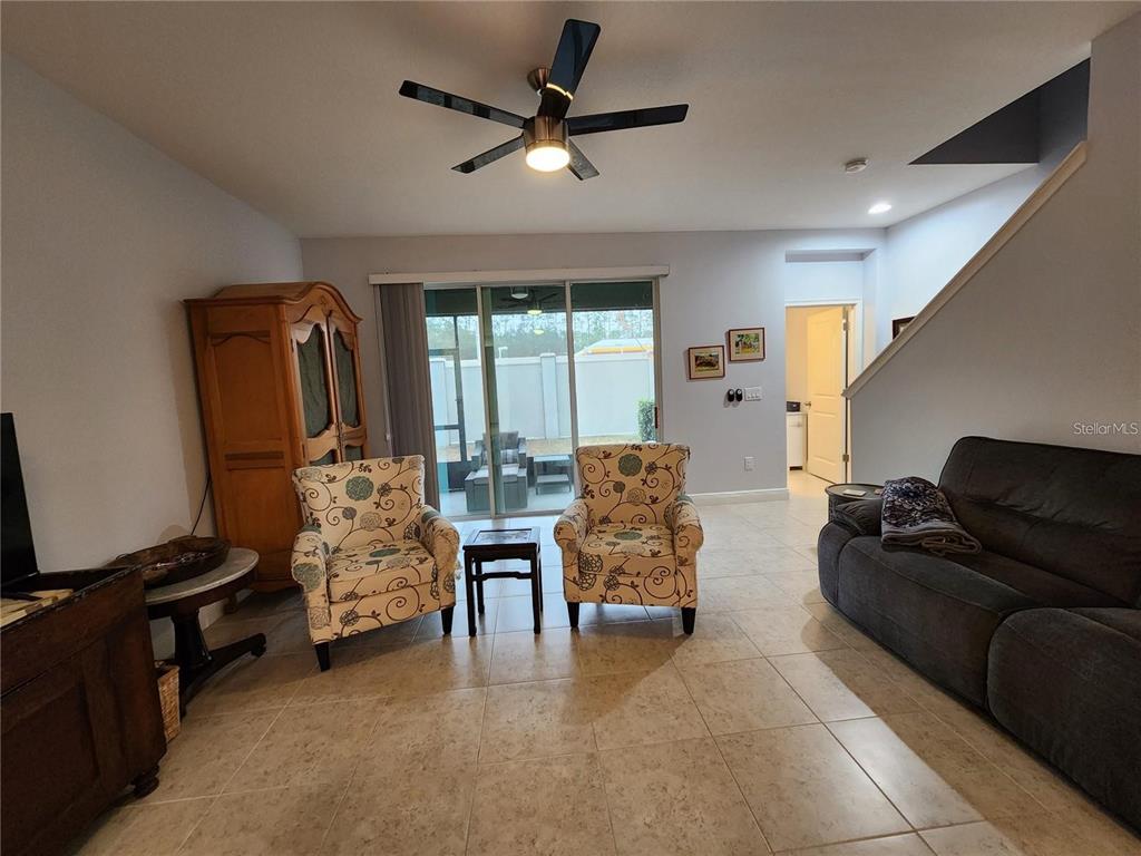 5514 Viola Lee Way Lutz, FL 33558 - Photo 11 of 17 a living room with furniture and a flat screen tv