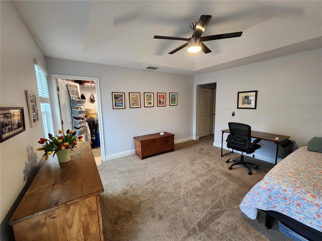 5514 Viola Lee Way Lutz, FL 33558 - Photo 4 of 17 a living room with furniture and a chandelier