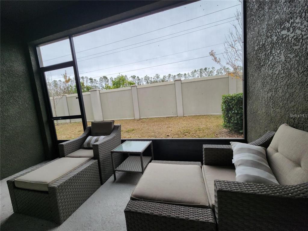 5514 Viola Lee Way Lutz, FL 33558 - Photo 10 of 17 a view of balcony with couch and wooden floor