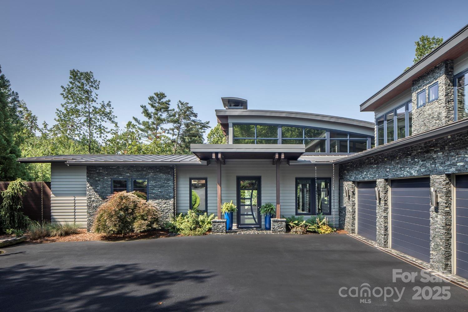 32 Brookline Drive Asheville, NC 28803 - Photo 1 of 44 a front view of a house with garden