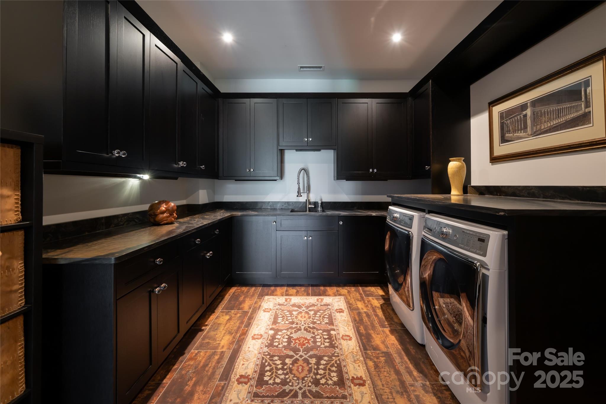 32 Brookline Drive Asheville, NC 28803 - Photo 26 of 44 a kitchen with kitchen island granite countertop stainless steel appliances stove a sink and a microwave