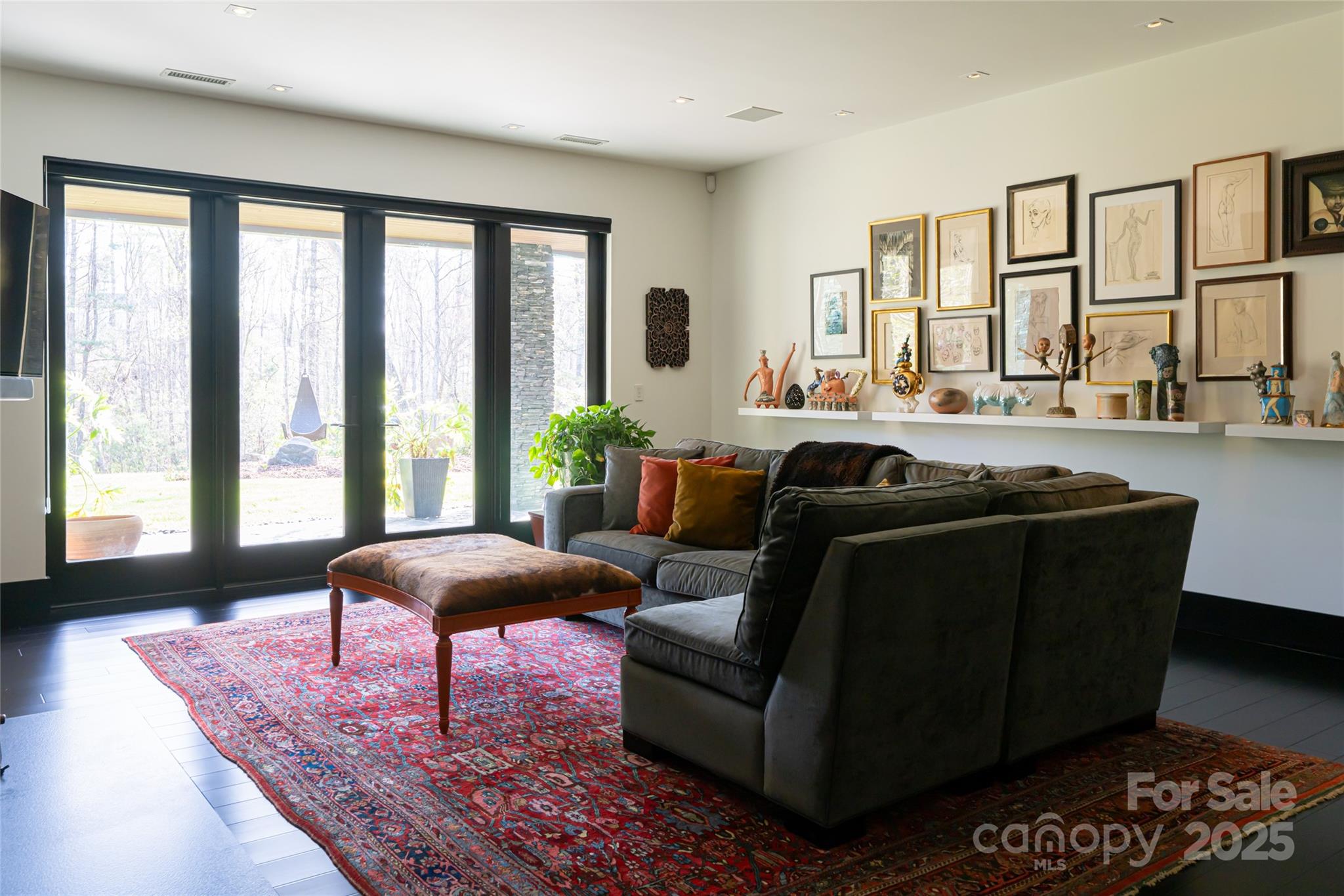 32 Brookline Drive Asheville, NC 28803 - Photo 28 of 44 a living room with furniture potted plant and a large window