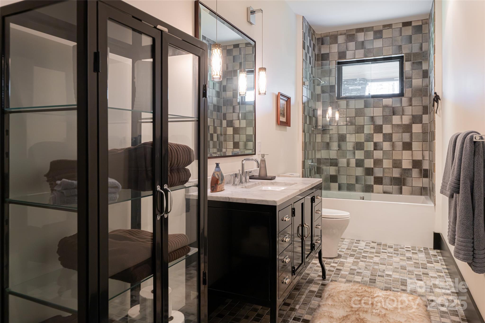 32 Brookline Drive Asheville, NC 28803 - Photo 32 of 44 a bathroom with a granite countertop sink and a mirror