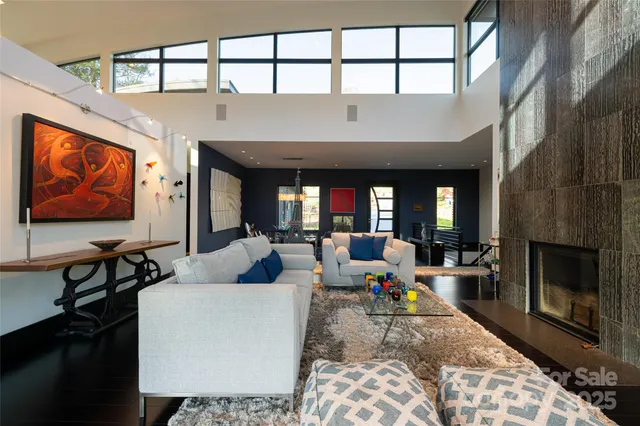 a large kitchen with stainless steel appliances granite countertop a sink and cabinets