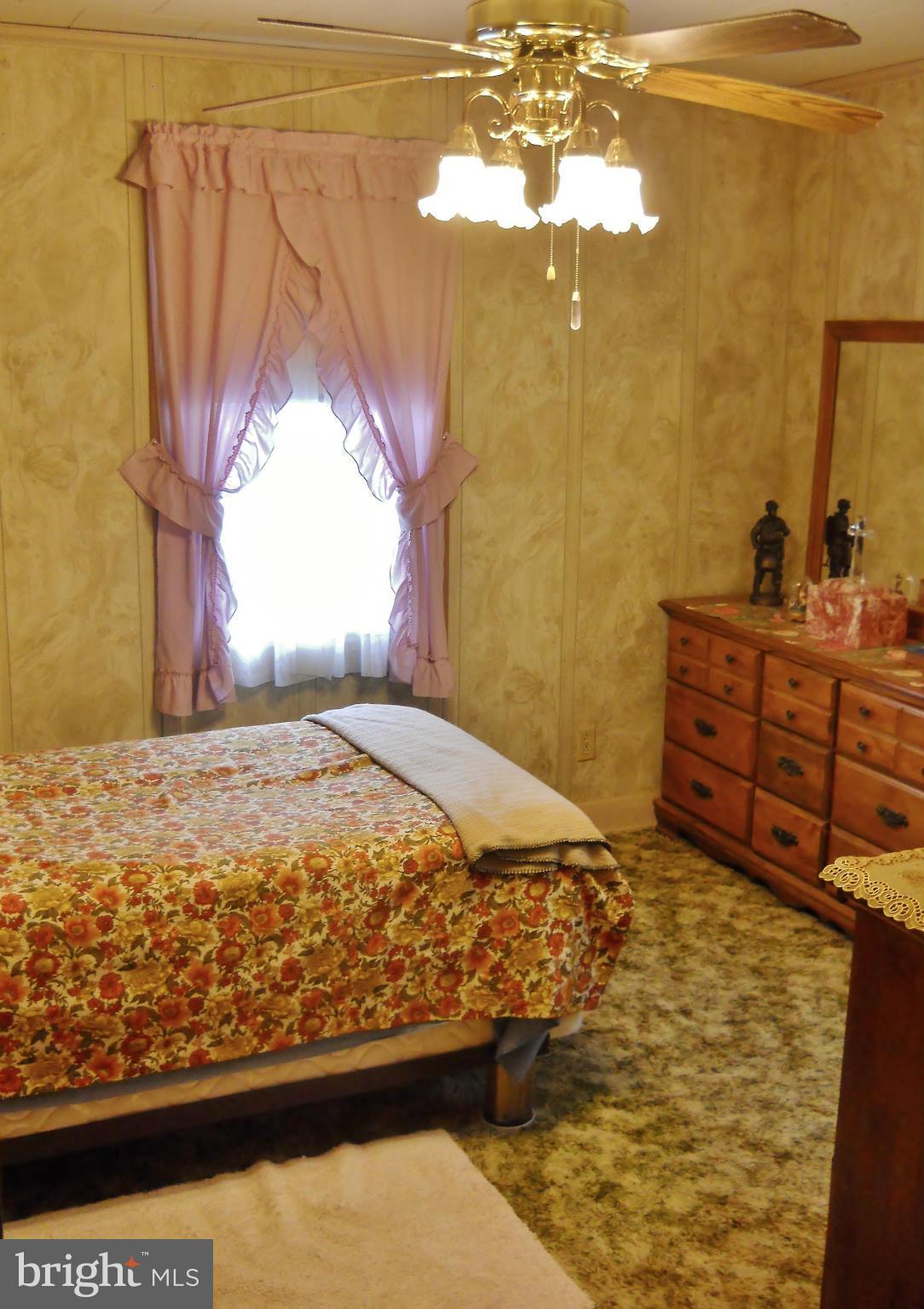 192 Magothy Beach Road Pasadena, MD 21122 - Photo 23 of 29 1st Bedroom w/ Hardwood Floor under carpet