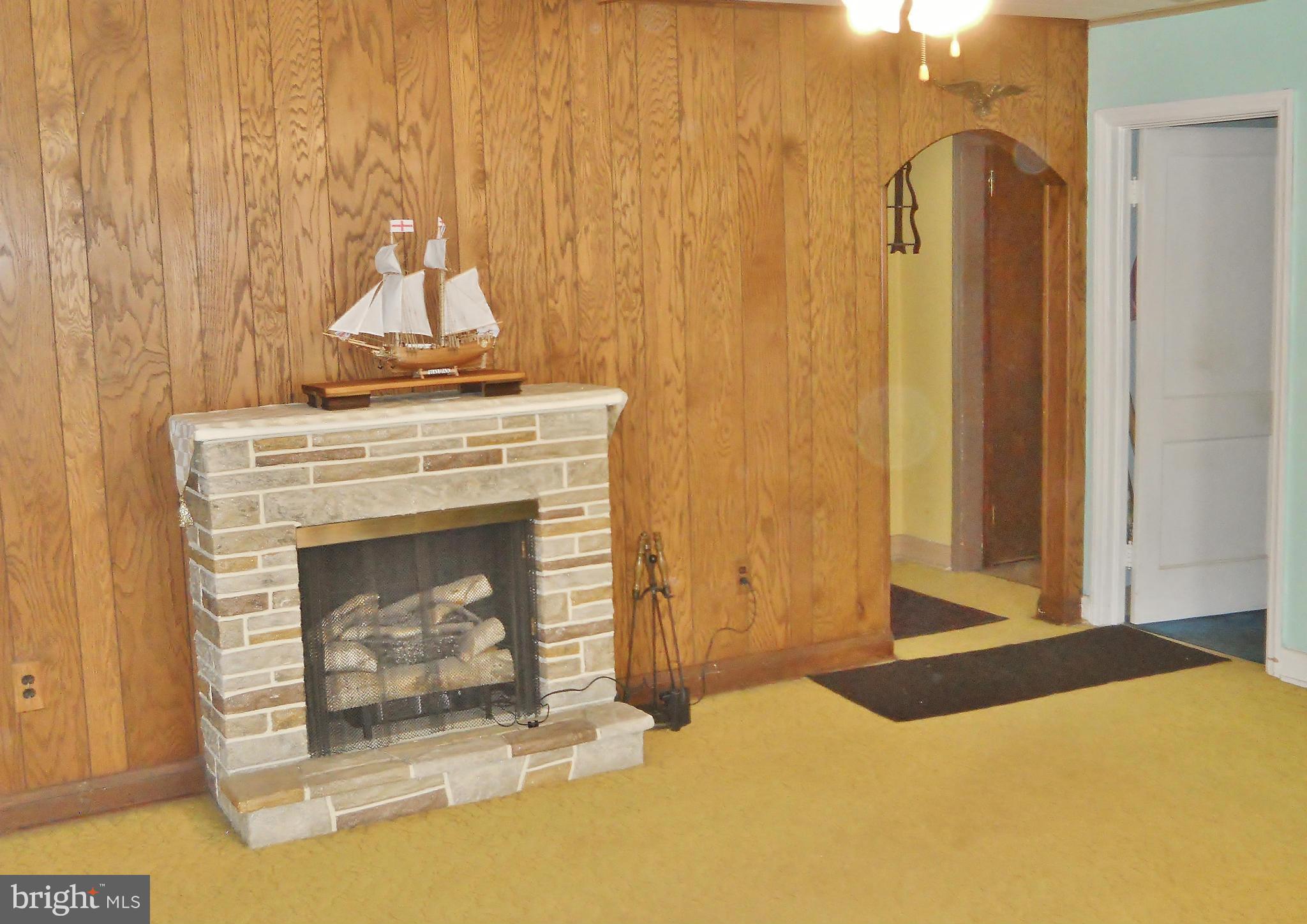 192 Magothy Beach Road Pasadena, MD 21122 - Photo 7 of 29 Living Room w/ Stone Electric Fireplace