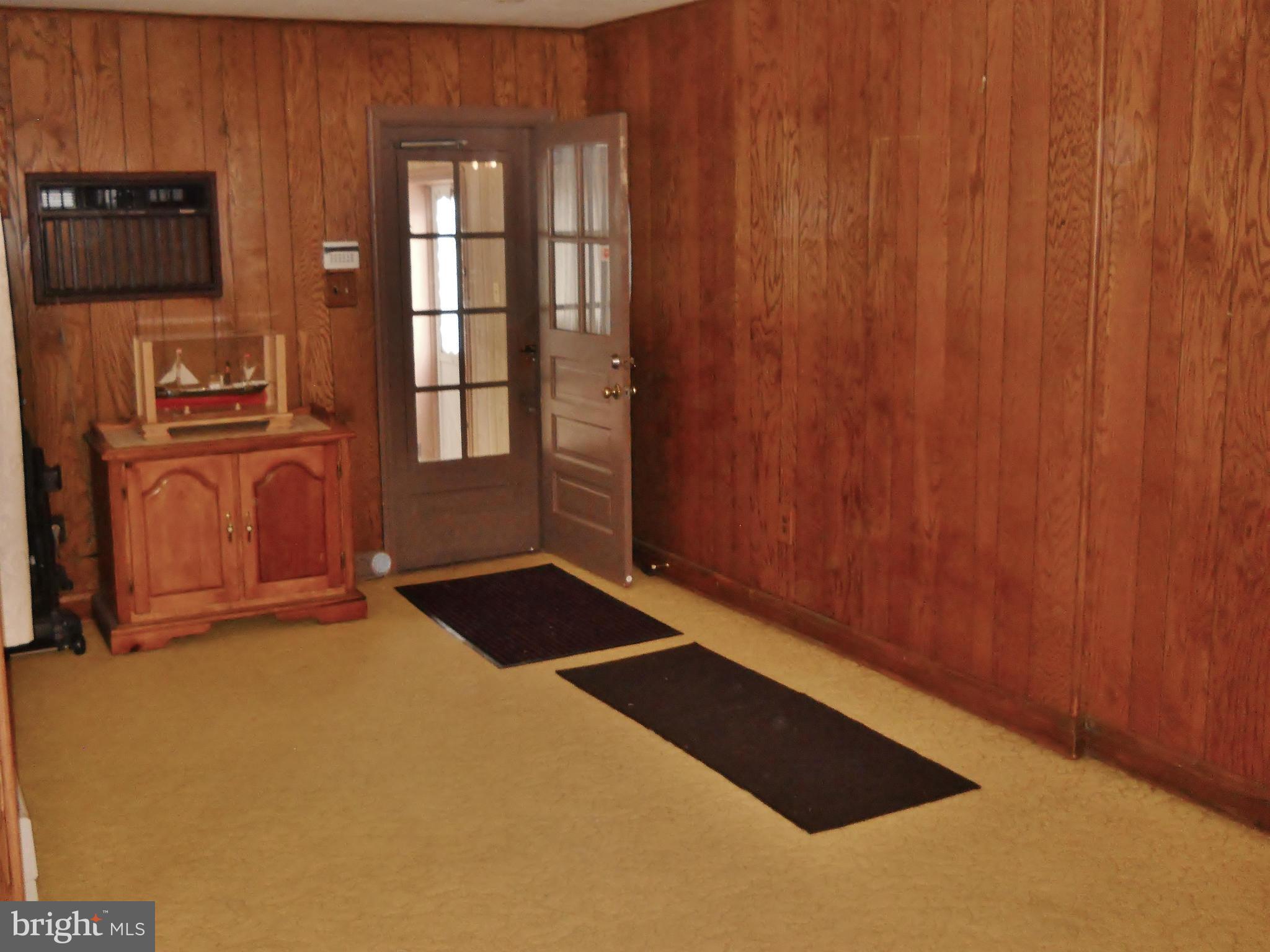 192 Magothy Beach Road Pasadena, MD 21122 - Photo 8 of 29 Sitting Room/Den w/ Hardwood Floor under carpet