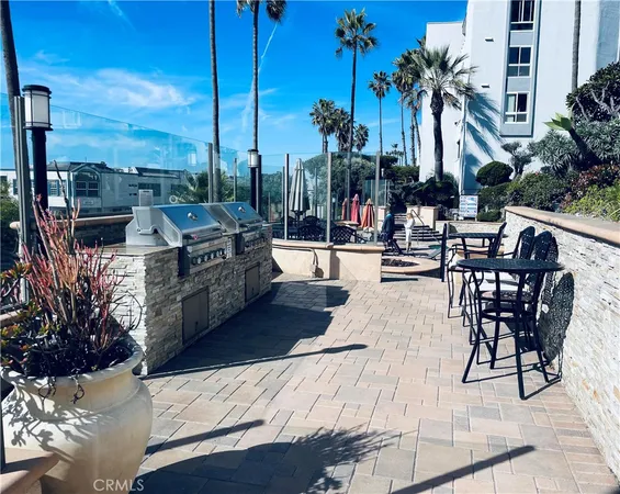 a view of swimming pool with outdoor seating and city view
