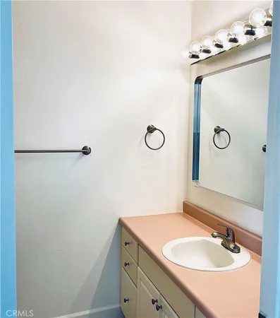 a bathroom with a sink and mirror