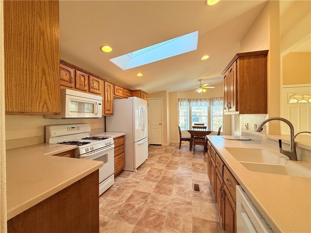 2350 Adobe Road Road, Unit 191 Bullhead City, AZ 86442 - Photo 15 of 52 a kitchen with stainless steel appliances granite countertop a sink stove and refrigerator