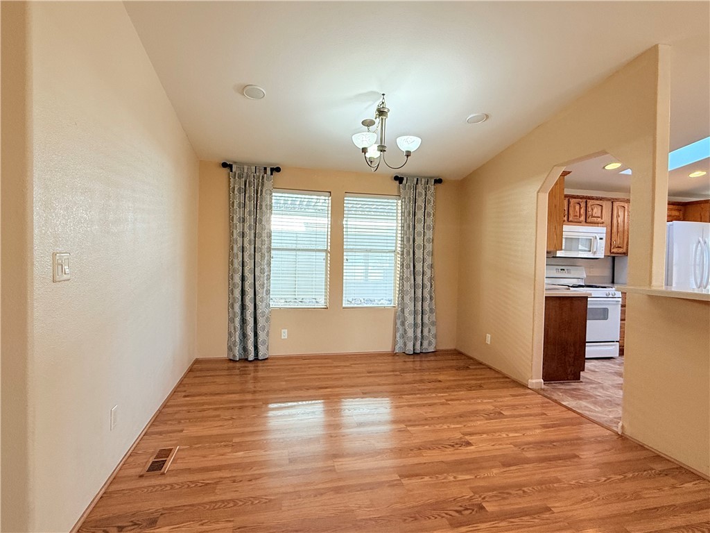 2350 Adobe Road Road, Unit 191 Bullhead City, AZ 86442 - Photo 20 of 52 wooden floor in an empty room with a window