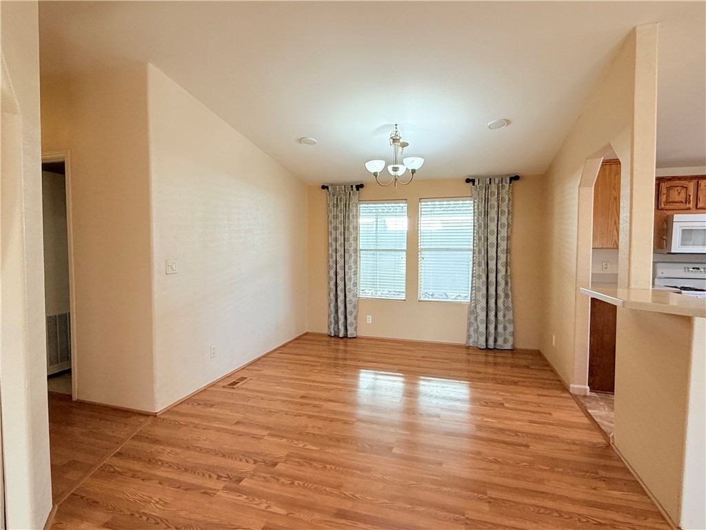 2350 Adobe Road Road, Unit 191 Bullhead City, AZ 86442 - Photo 21 of 52 a view of an empty room with wooden floor and a window