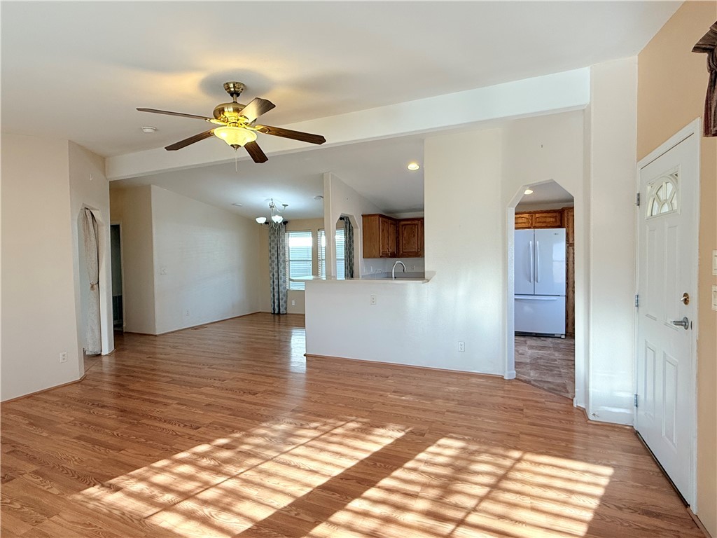 2350 Adobe Road Road, Unit 191 Bullhead City, AZ 86442 - Photo 23 of 52 a view of an empty room with kitchen and wooden floor