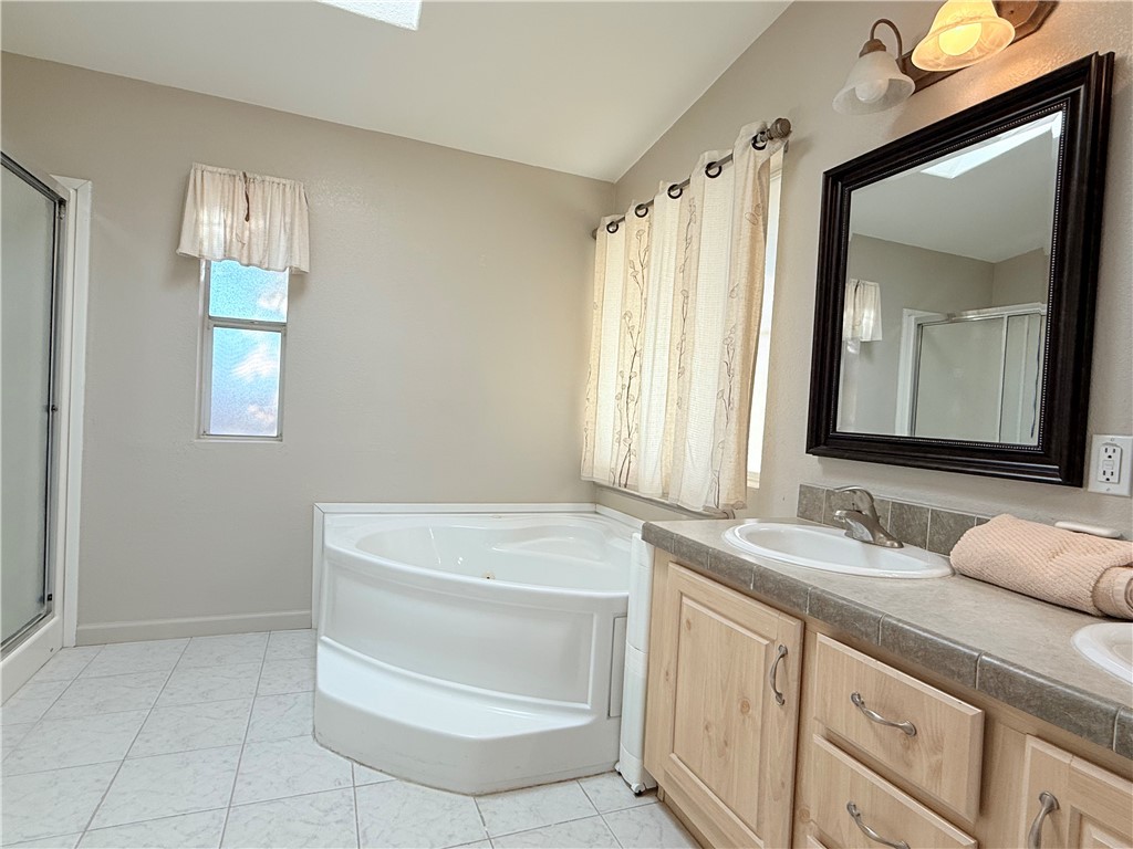 2350 Adobe Road Road, Unit 191 Bullhead City, AZ 86442 - Photo 30 of 52 a bathroom with a sink a vanity and a mirror