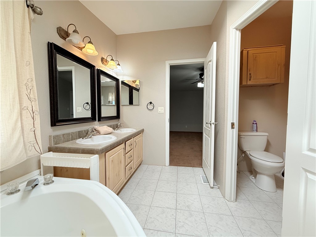 2350 Adobe Road Road, Unit 191 Bullhead City, AZ 86442 - Photo 32 of 52 a spacious bathroom with a sink and a mirror