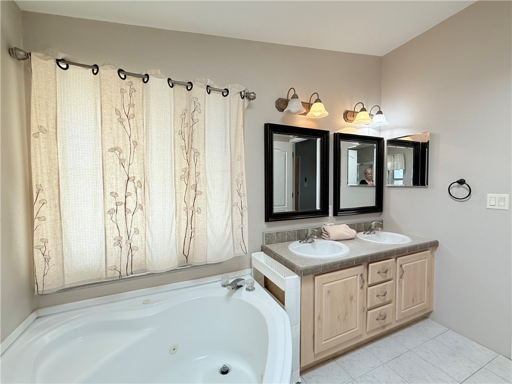 2350 Adobe Road Road, Unit 191 Bullhead City, AZ 86442 - Photo 33 of 52 a bathroom with a granite countertop sink and a mirror