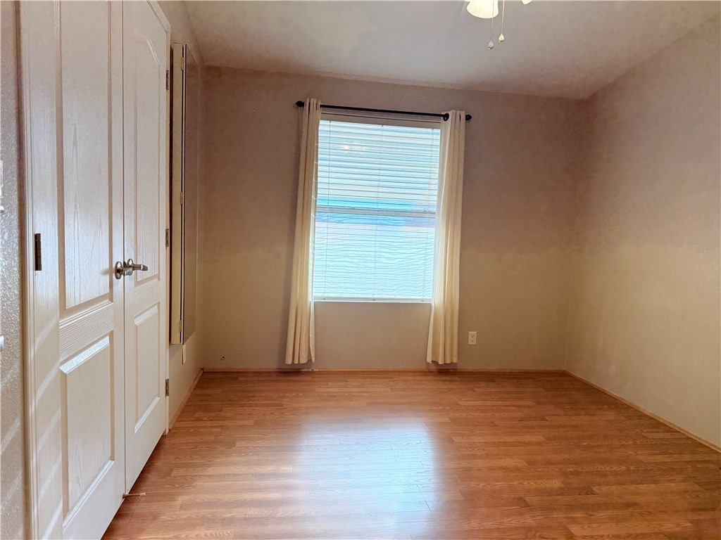 2350 Adobe Road Road, Unit 191 Bullhead City, AZ 86442 - Photo 35 of 52 an empty room with wooden floor and windows