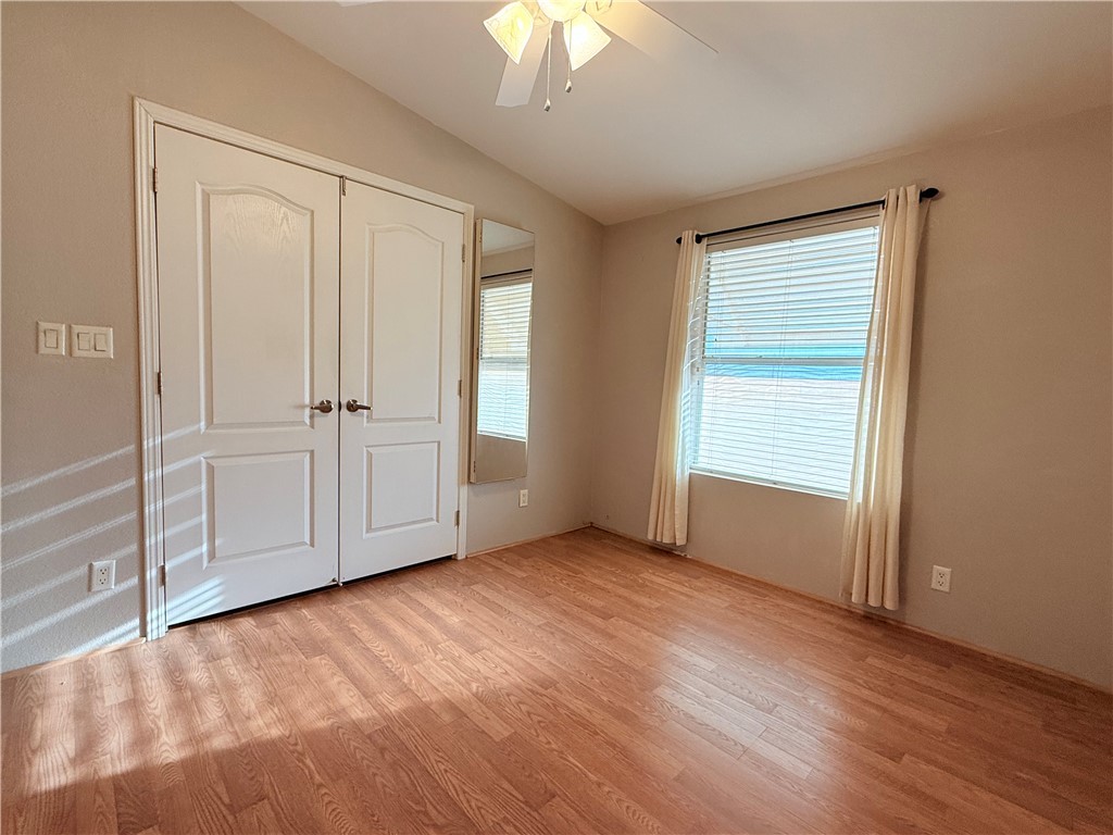 2350 Adobe Road Road, Unit 191 Bullhead City, AZ 86442 - Photo 36 of 52 an empty room with wooden floor closet and windows