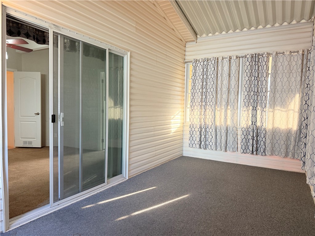 2350 Adobe Road Road, Unit 191 Bullhead City, AZ 86442 - Photo 52 of 52 Back sunroom off of primary bedroom. Sliding door access primary bedroom