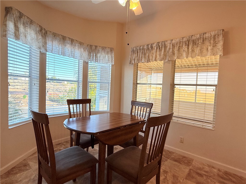 2350 Adobe Road Road, Unit 191 Bullhead City, AZ 86442 - Photo 8 of 52 a view of a dining room with furniture and a window