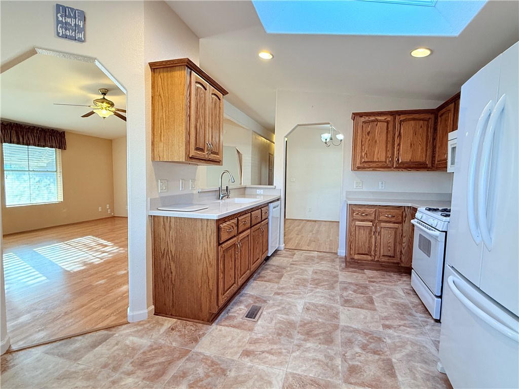2350 Adobe Road Road, Unit 191 Bullhead City, AZ 86442 - Photo 9 of 52 a kitchen with stainless steel appliances granite countertop a stove a sink and a refrigerator