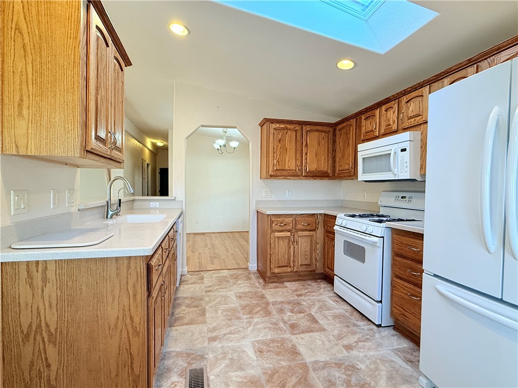 2350 Adobe Road Road, Unit 191 Bullhead City, AZ 86442 - Photo 10 of 52 a kitchen with stainless steel appliances granite countertop a sink stove and refrigerator