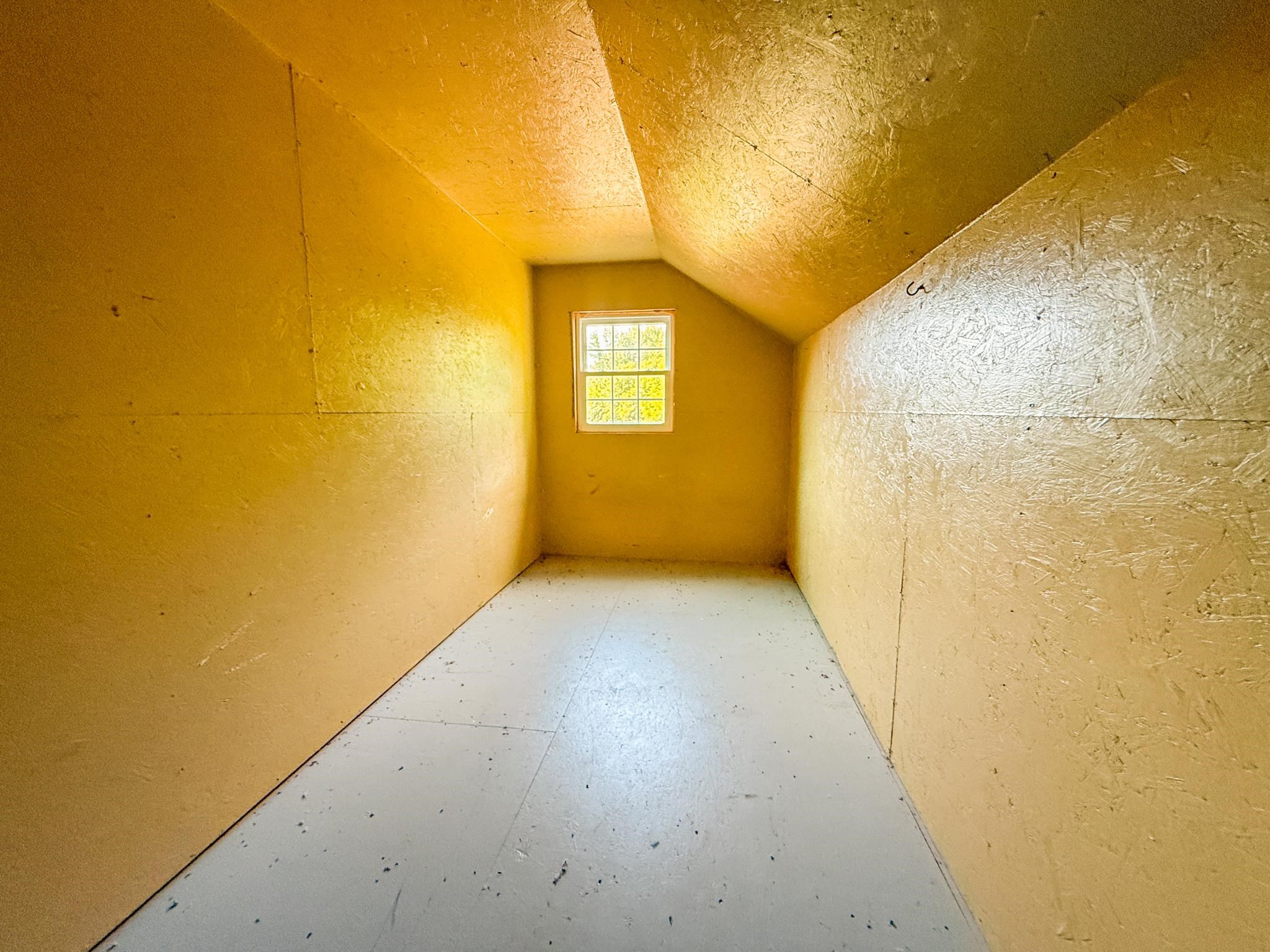 1421 Copper Spring Road Springville, TN 38256 - Photo 18 of 40 Attic space with sloped ceilings and a single window