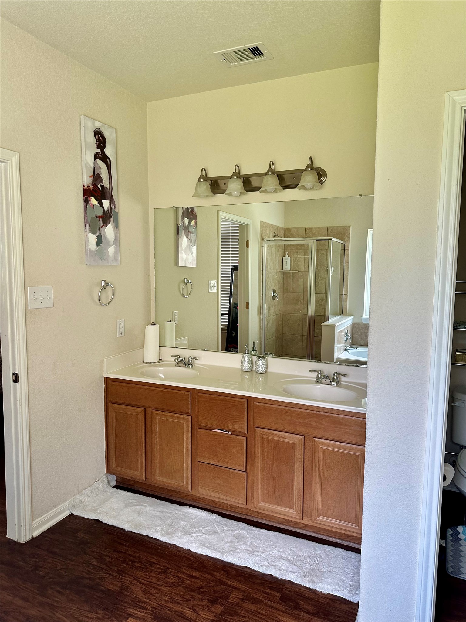 18622 Each Elm Way Houston, TX 77084 - Photo 16 of 35 a spacious bathroom with a granite countertop sink and a mirror