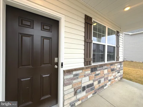 front of a house with a large window