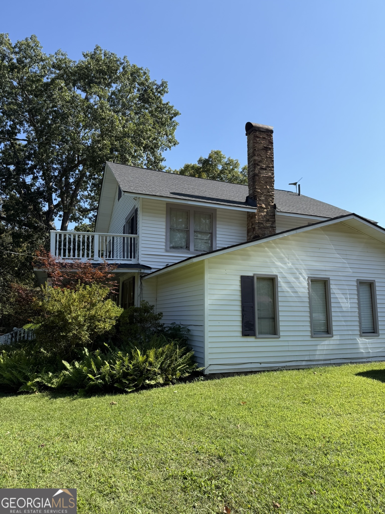 51 Cedar Street Menlo, GA 30731 - Photo 13 of 86 a front view of a house with garden