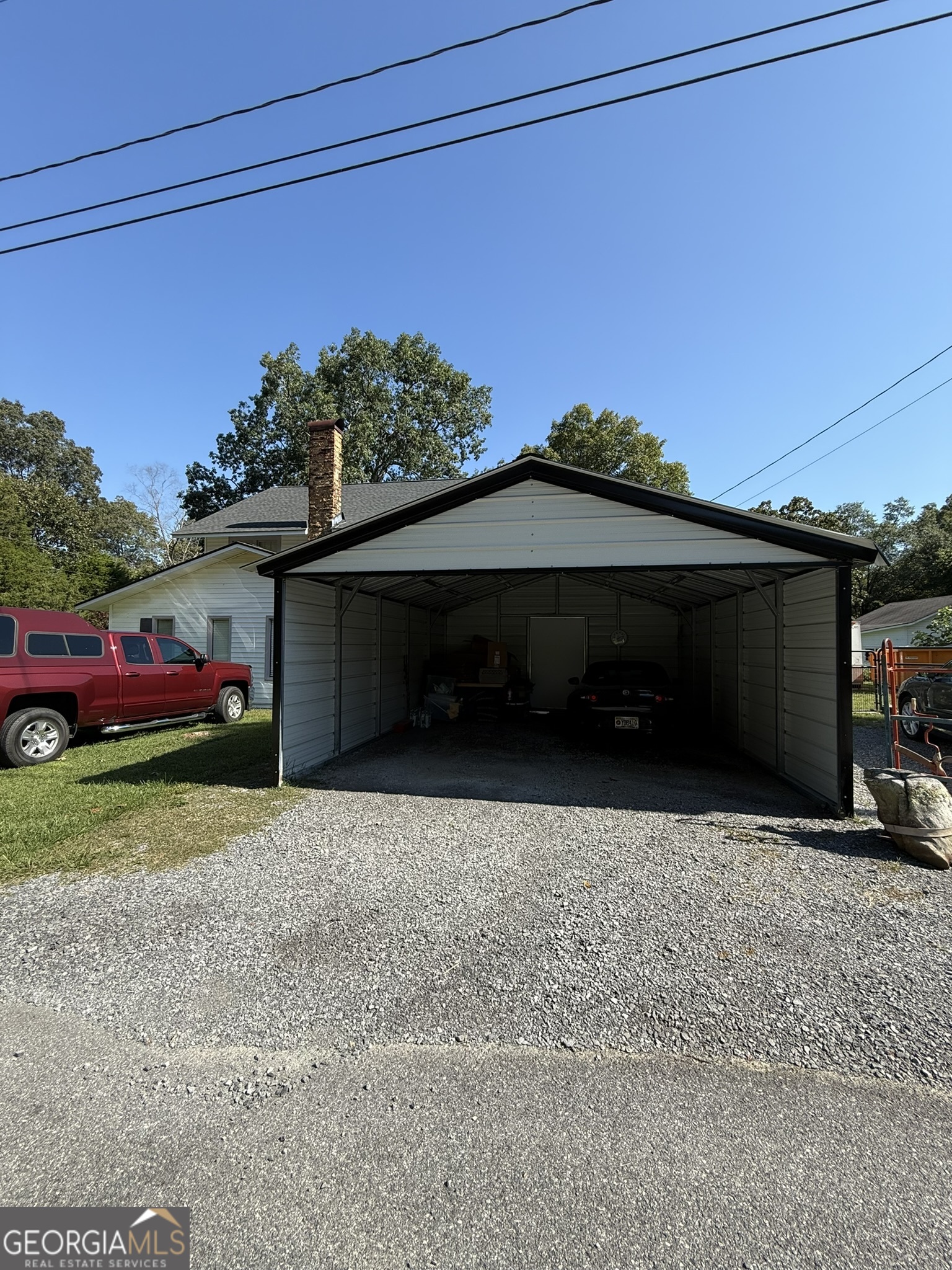51 Cedar Street Menlo, GA 30731 - Photo 14 of 86 a front view of a house with a yard