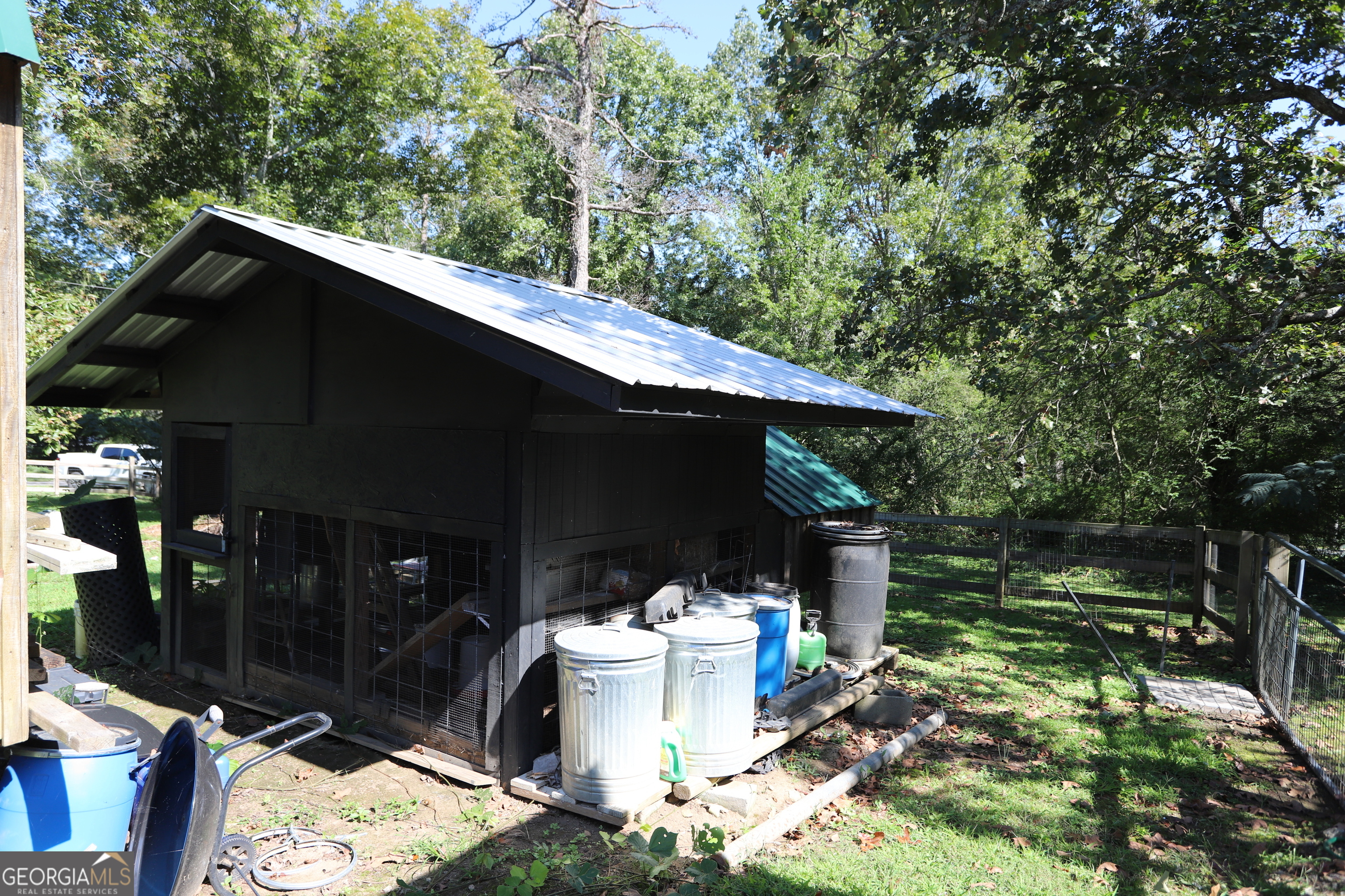 51 Cedar Street Menlo, GA 30731 - Photo 27 of 86 a backyard of a house with yard and outdoor seating