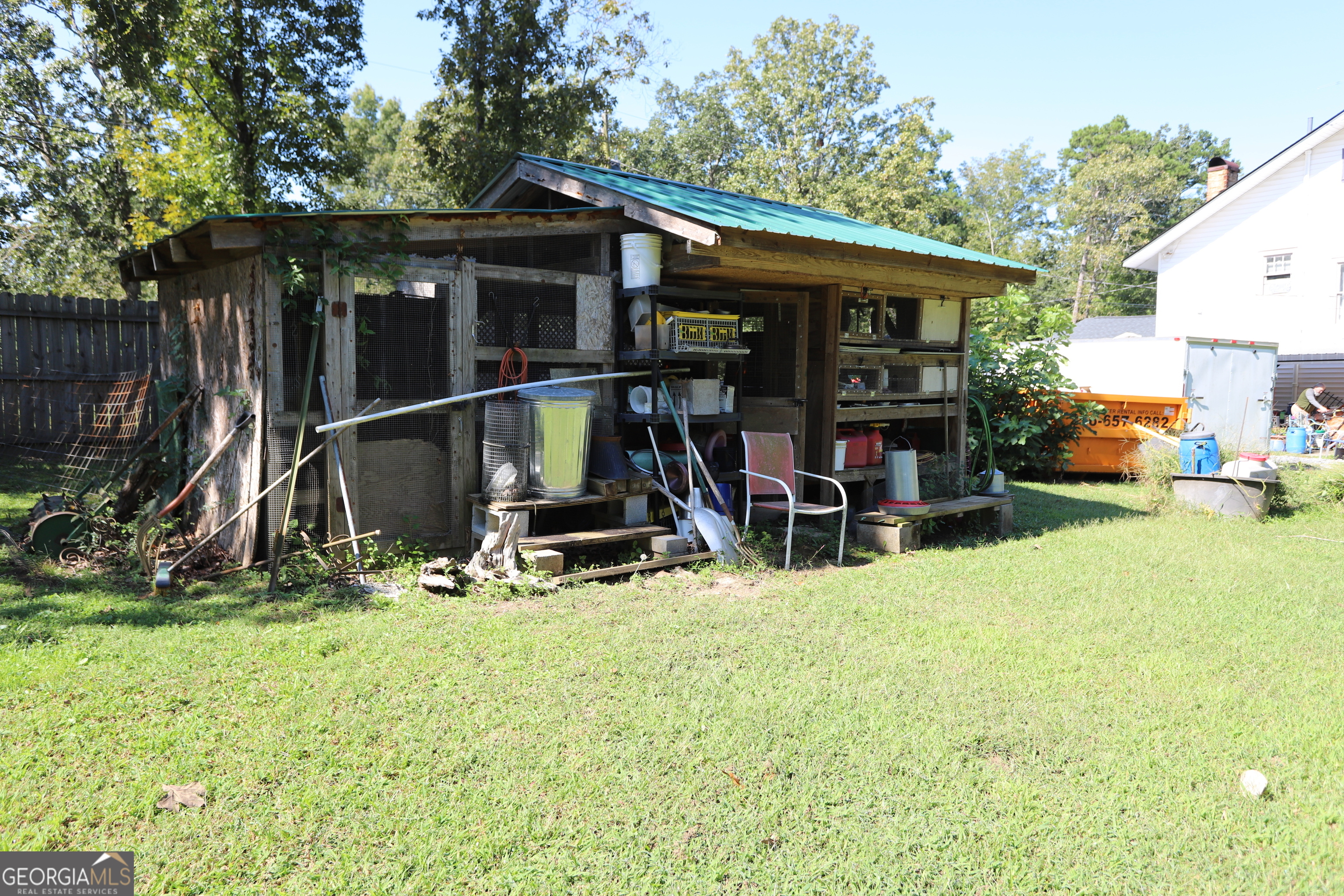 51 Cedar Street Menlo, GA 30731 - Photo 34 of 86 a view of backyard with table and chairs and wooden fence