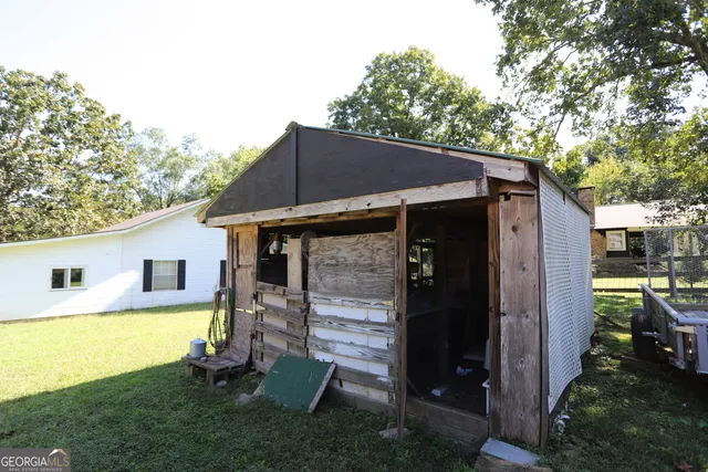 a living room with lots of furniture and a chandelier