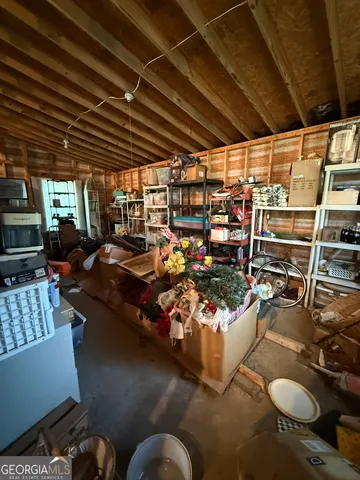a room with furniture a flat screen tv and a floor to ceiling window