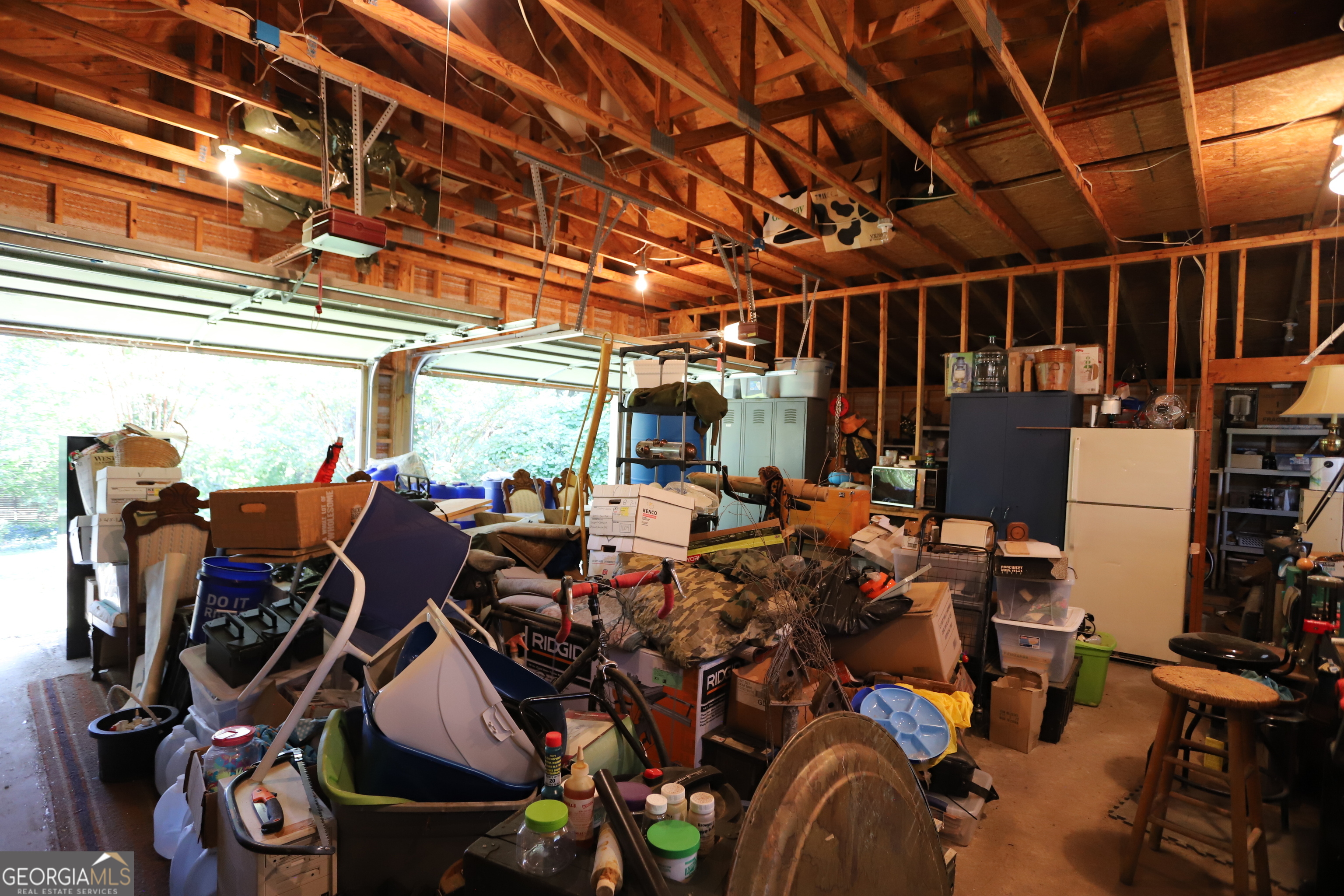 51 Cedar Street Menlo, GA 30731 - Photo 46 of 86 a view of a storage room with washer and dryer