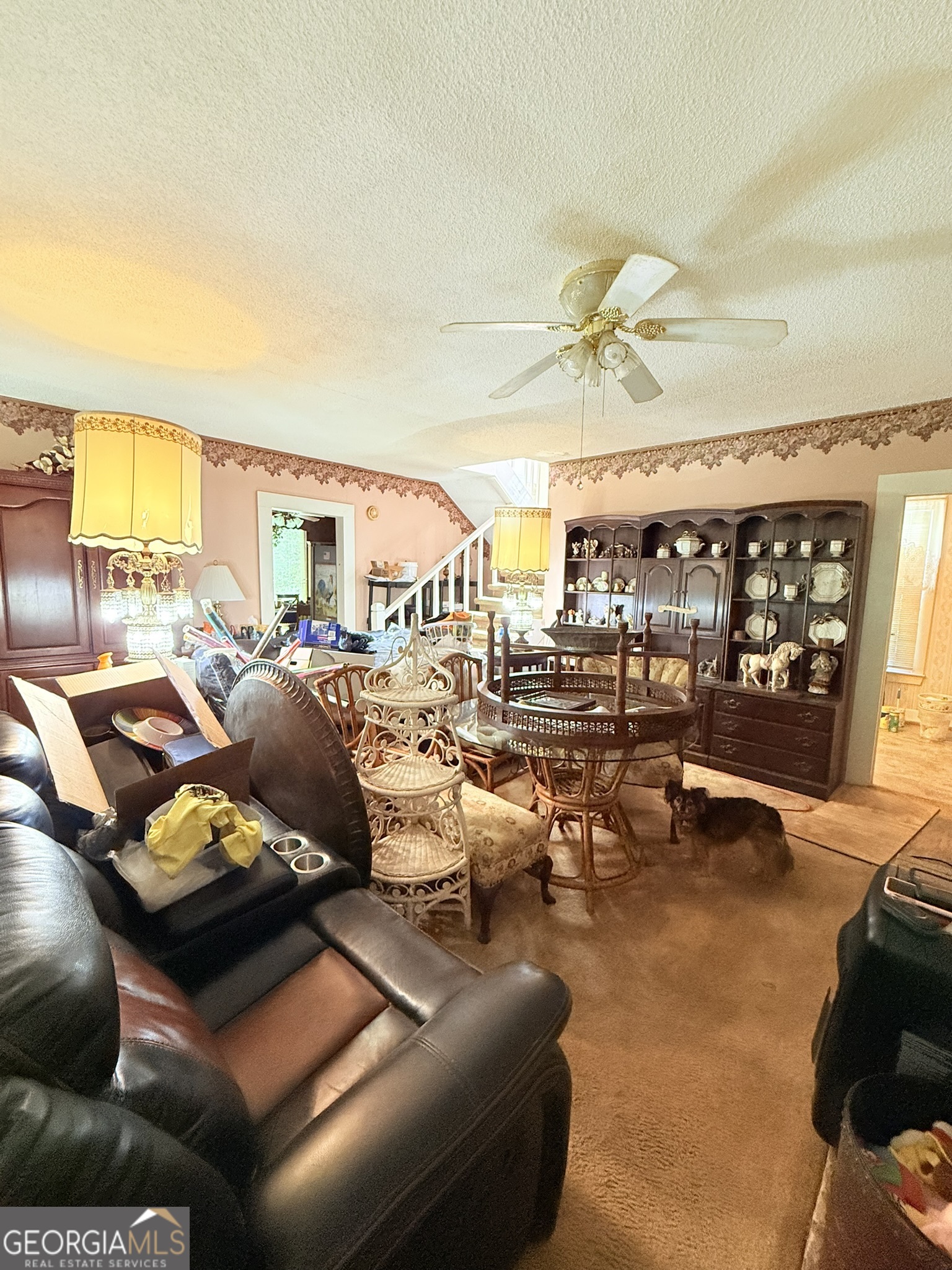 51 Cedar Street Menlo, GA 30731 - Photo 55 of 86 a living room with lots of furniture and a chandelier