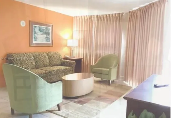 a living room with furniture and a bathtub